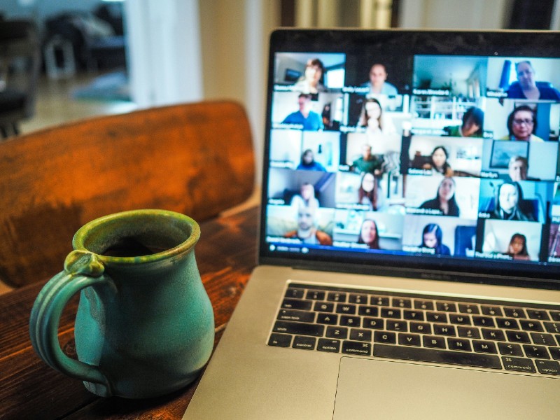 Online meeting showing laptop and mug