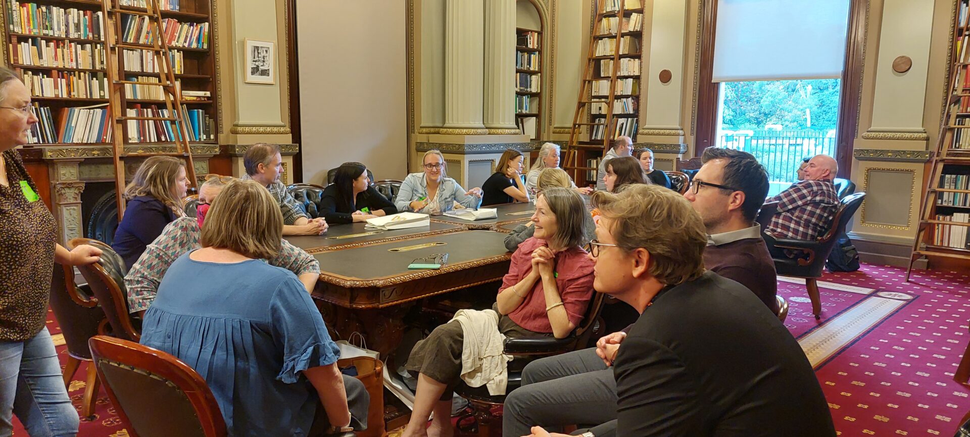 Groups of people sitting round tables