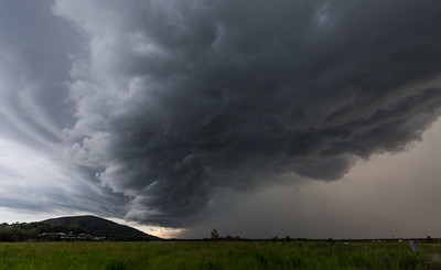 Very dark and menacing looking clouds in a wide landscape